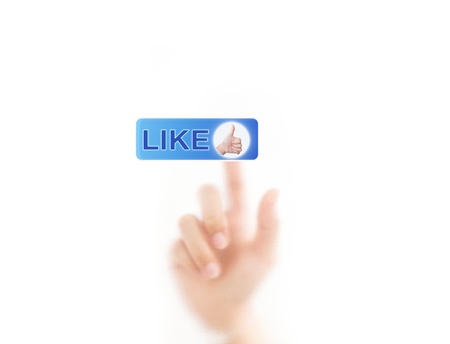 finger pressing Social Network icon on like buttonの写真素材