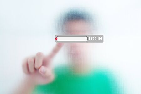 Human finger pressing login buttonの写真素材