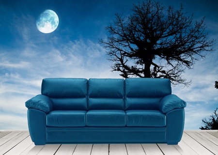 Wooden terrace and blue sofaの写真素材