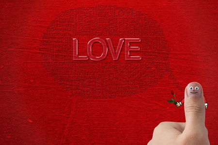 Smiled Thumb up with hand holding rose , for valentineの写真素材