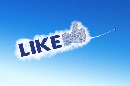 LIKE symbol on the sky with plane carrying the cloudの写真素材