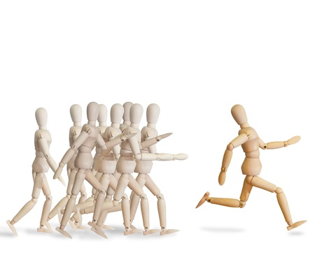 Wooden man run over the crowd for Human Resources conceptの写真素材