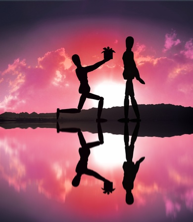 silhouette Love surprise gift from wooden model coupleの写真素材