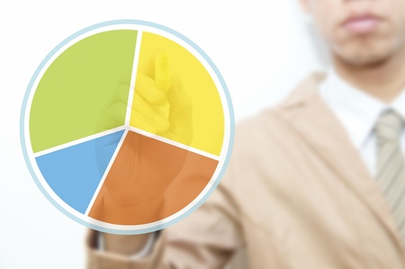 Young business man use hand drawing pie graphの写真素材