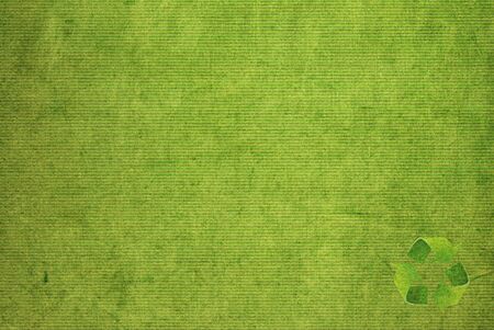 Recycle symbol on the Paper texture backgroundの写真素材