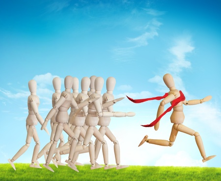 Wooden man run over the crowd for Human Resources conceptの写真素材