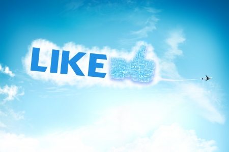 Thumb up like hand symbol with tag cloud of word on the skyの写真素材
