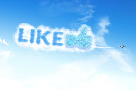 Thumb up like hand symbol with tag cloud of word on the skyの写真素材