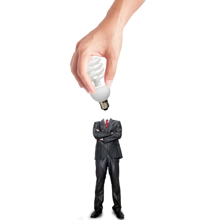 Hand holding bulb for plug-in the business man bodyの写真素材