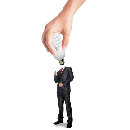 Hand holding bulb for plug-in the business man bodyの写真素材