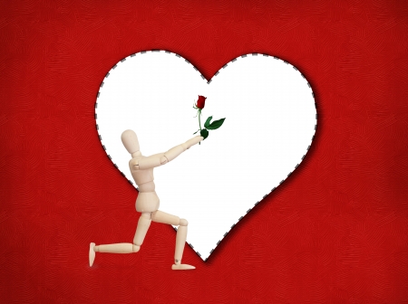 Wooden model handing over love gift to friend on Valentine dayの写真素材