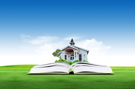 House on green book over the cloud with sky backgroundの写真素材