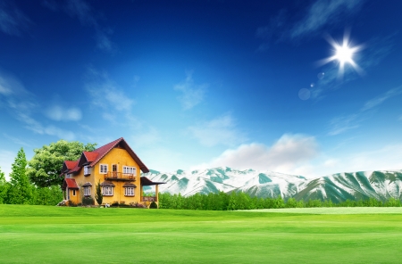 House on green field landscape with bule sky and sunの写真素材