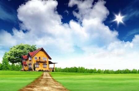 House on green field landscape with bule sky and sunの写真素材