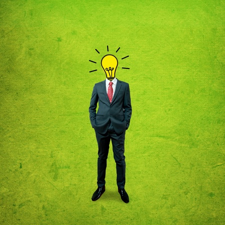 Business man with bulb head on the screen backgroundの写真素材