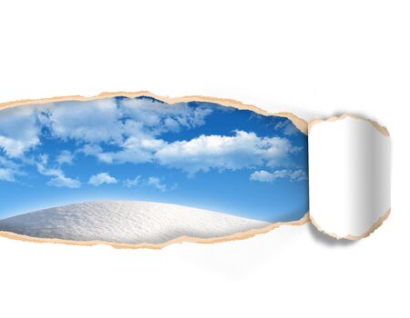 Torn paper with landscape sky in opening backgroundの写真素材