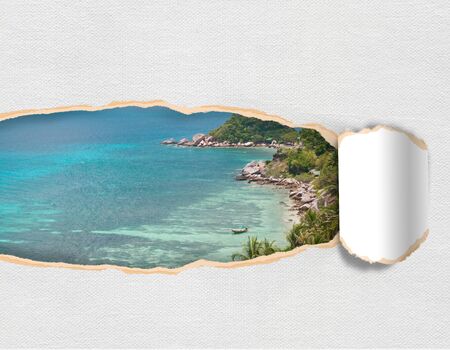 Torn paper with landscape island sky in opening backgroundの写真素材