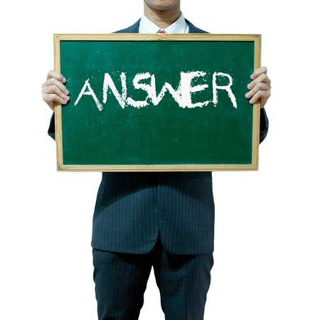 Business man holding blackboard on the background , Answerの写真素材