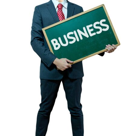 Business man holding board on the background with business wordの写真素材