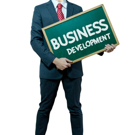 Business man holding board on the background with business wordの写真素材