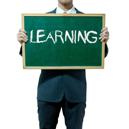 Business man holding blackboard on the background , Educationの写真素材