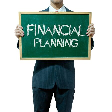 Business man holding blackboard on the background , Financialの写真素材