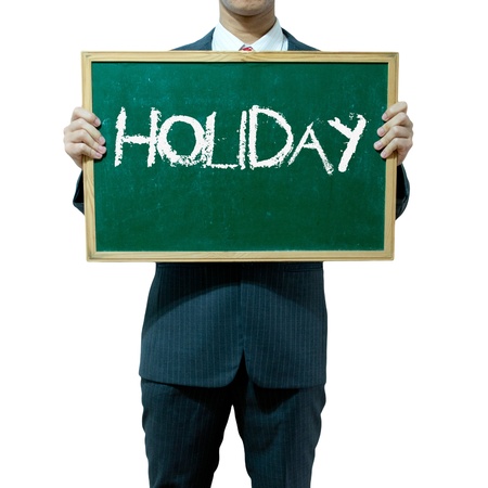 Business man holding blackboard on the background , Holidayの写真素材
