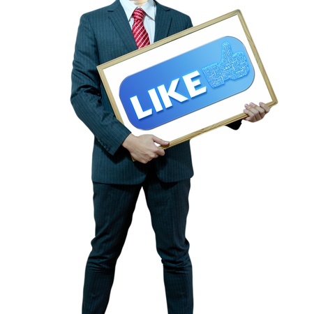 Business man holding board on the background with symbolの写真素材