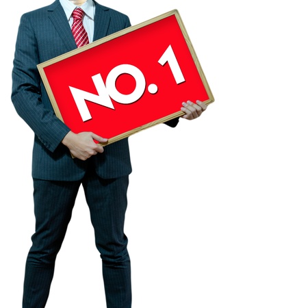 Business man holding black board winner number 1の写真素材