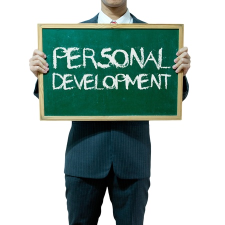 Business man holding blackboard on the background , Personal developmentの写真素材