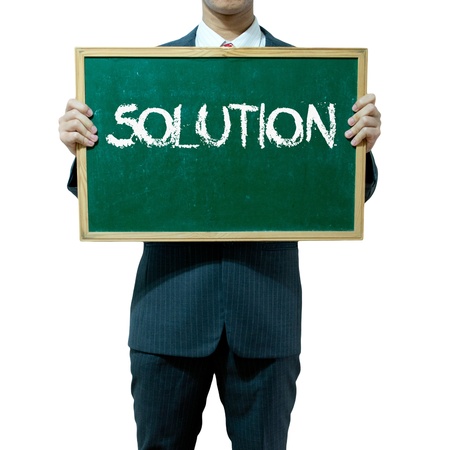 Business man holding blackboard on the background , Solutionの写真素材