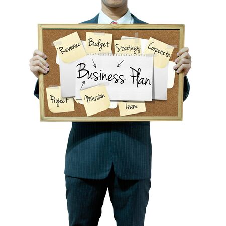 Business man holding board on the background, Business Plan conceptの写真素材