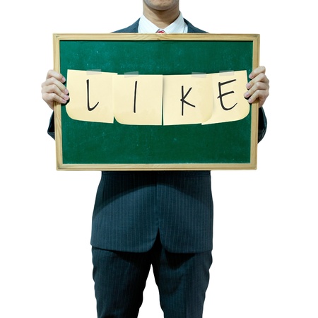 Business man holding board on the background, LIKEの写真素材