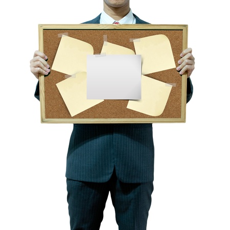 Business man holding cork board on the backgroundの写真素材