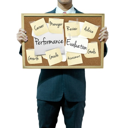 Business man holding board on the background, Performance Evaluation conceptの写真素材