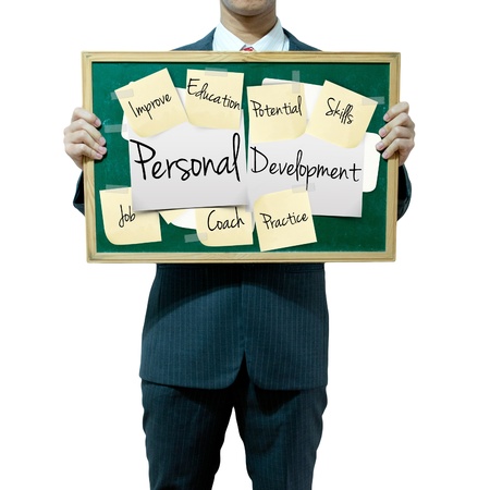 Business man holding board on the background, Personal Development conceptの写真素材