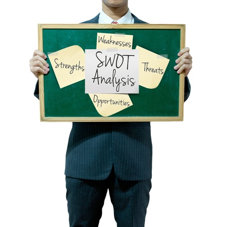 Business man holding board on the background, SWOT Analysisの写真素材