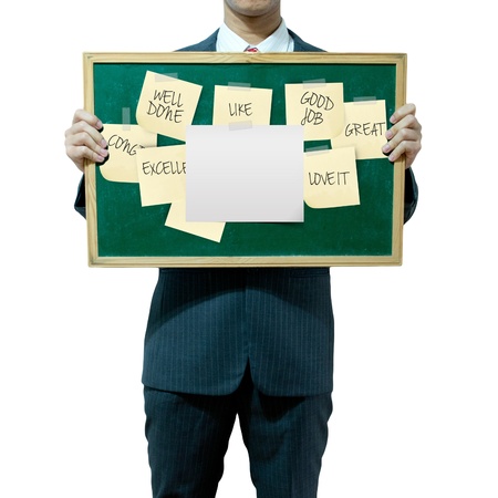 Business man holding board on the background, complimentsの写真素材