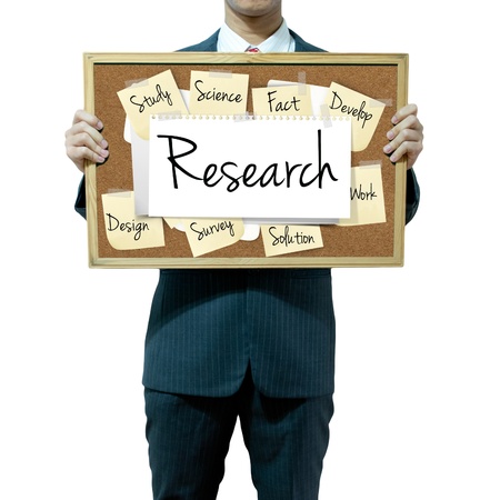 Business man holding board on the background, Researchの写真素材