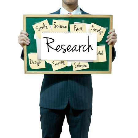 Business man holding board on the background, Researchの写真素材