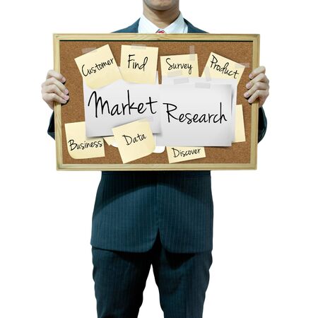 Business man holding board on the background, Market Researchの写真素材