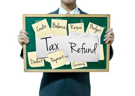 Business man holding board on the background, Tax Refundの写真素材