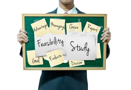 Business man holding board on the background, Feasibility Studyの写真素材