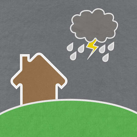 Landscape of green grass and home with stitch style on fabrix backgroundの写真素材