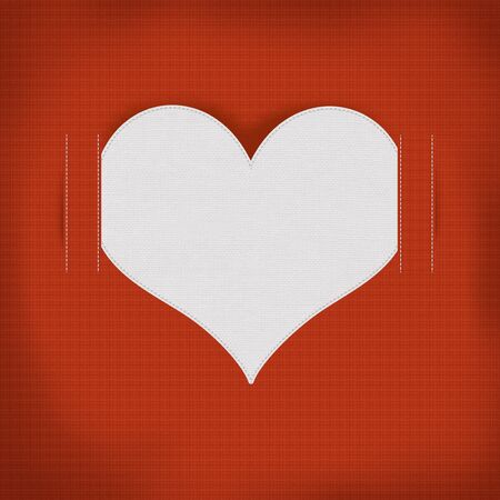Heart sewing with white thread on the fabric texture backgroundの写真素材