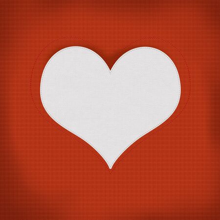 Heart sewing with white thread on the fabric texture backgroundの写真素材
