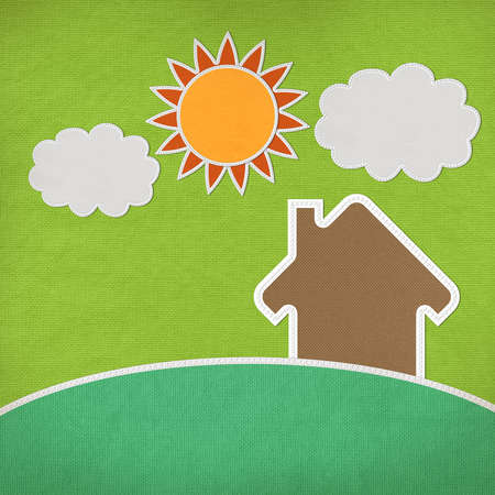 Landscape of green grass and home with stitch style on fabrix backgroundの写真素材