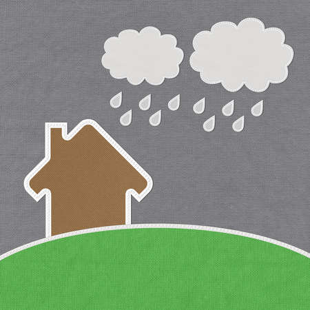 Landscape of green grass and home with stitch style on fabrix backgroundの写真素材
