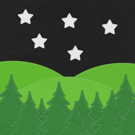 Landscape with pine forests in the mountains with stitch style on fabric backgroundの写真素材