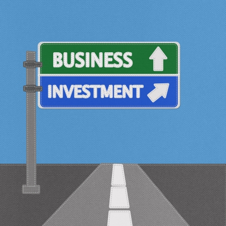 Business investment highway sign concept with stitch style on fabric backgroundの写真素材